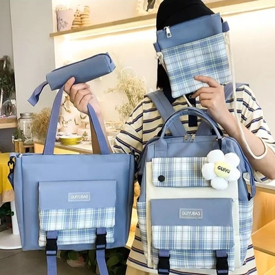 Le ragazze della tela istruiscono l'istituto universitario che dell'insieme della borsa la borsa di libro sveglia impermeabile mette il portafoglio